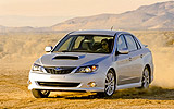 Subaru Impreza Sed�n. Modelo 2009. Im�gen. Frontal lateral. Movimiento. Coche gris. 
