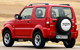 Suzuki Jimny. Modelo 2008. Imagen exterior. Lateral posterior. Movimiento. Carretera. Rojo.