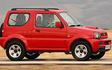 Suzuki Jimny. Modelo 2008. Imagen exterior. Lateral. Movimiento. Carretera. Rojo.