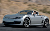 Volkswagen Concept BlueSport. Prototipo 2009. Imagen. Exterior. Frontal lateral. Coche en movimiento. Carretera. Gris.