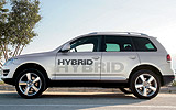 Volkswagen Touareg Hybrid. Prototipo 2009. Imagen. Exterior. Lateral. Coche parado. Carretera. Gris.